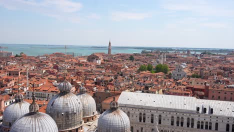 panning left shot from campanile in piazza san marco over red roofs of venice