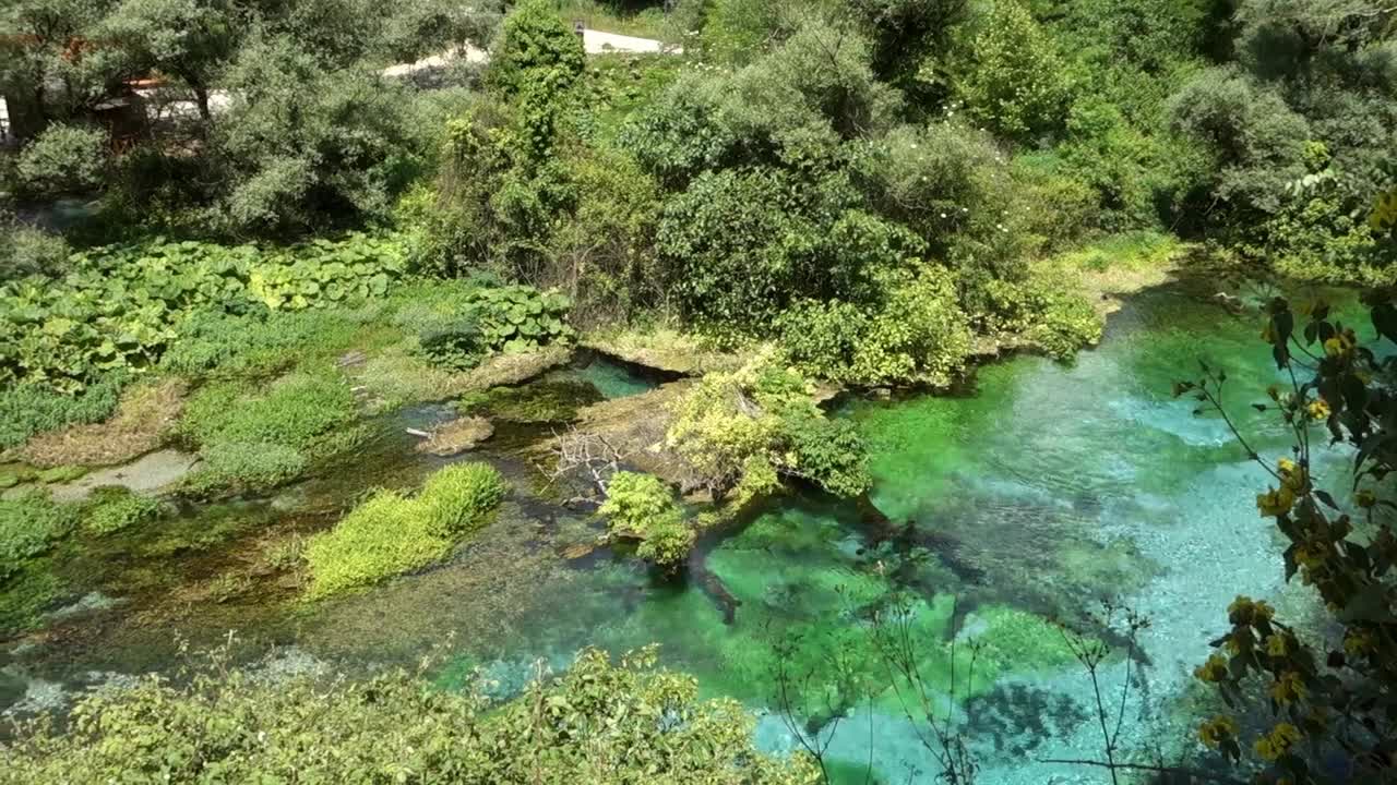 Turquoise and green water in the spring of Blue Eye Lake near to Saranda, Albania