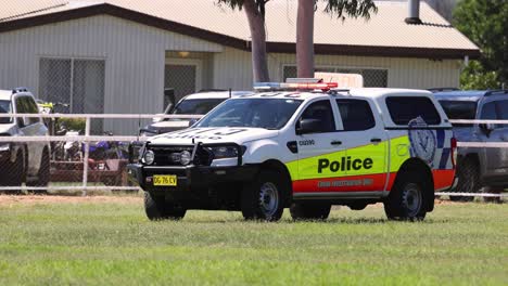 police car parked on grass monitoring area