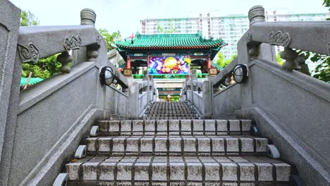 ascending stone steps towards a vibrant temple