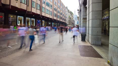 italy sunny milan city famous shopping street crowded rotating panorama 4k timelapse