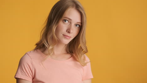 caucasian woman calmly looking at camera.