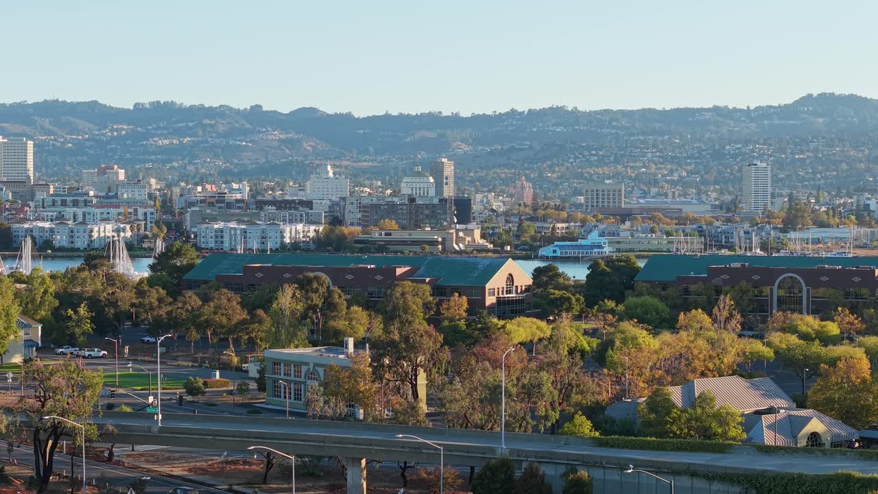 A static view of Webster Street in Alameda California. Downtown Oakland is seen in the distance