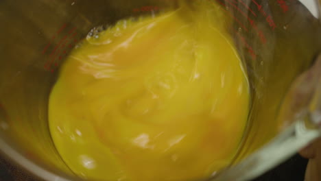 Mixing-four-egg-yolks-with-chopsticks