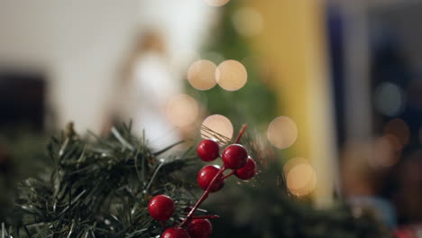 unrecognizable children decorationg a christmas tree at home