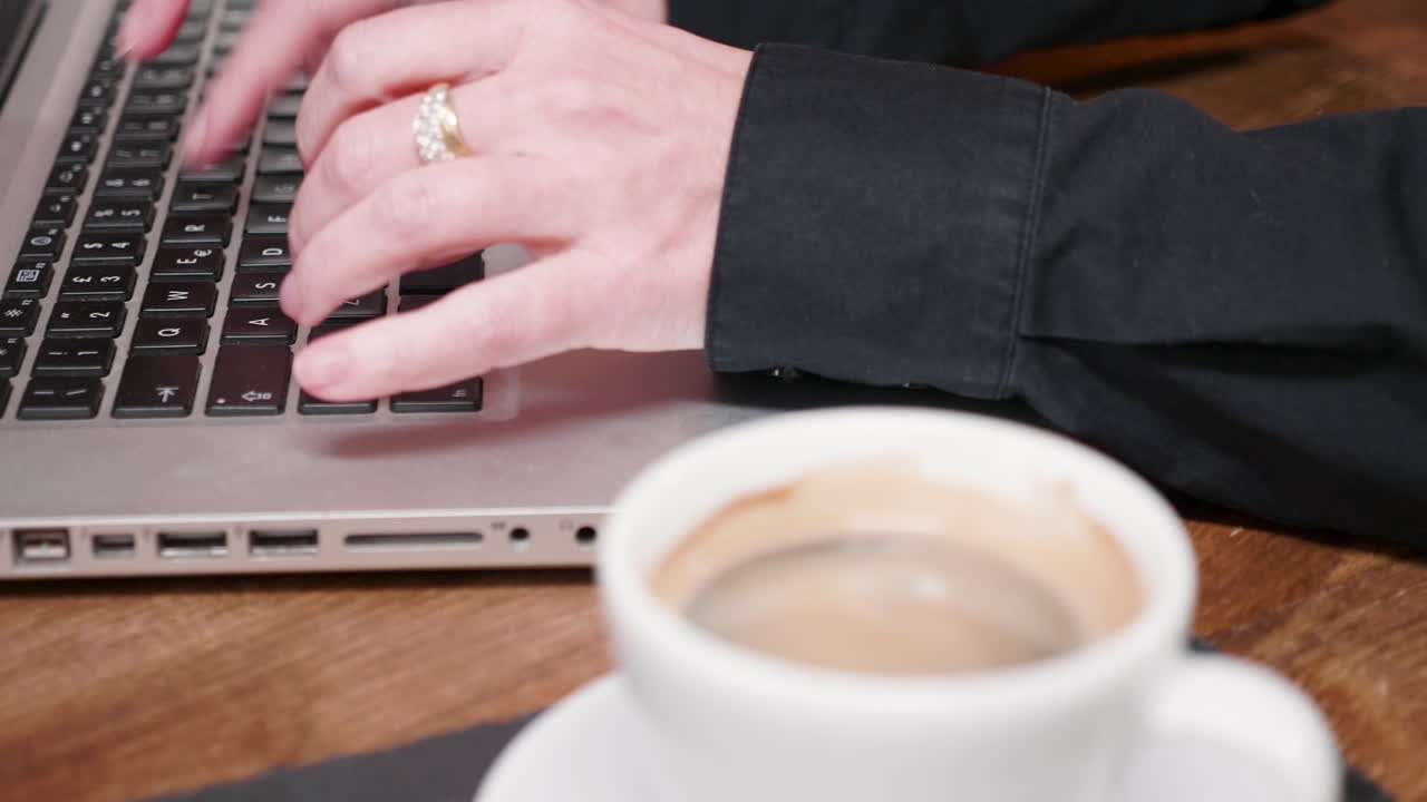 Laptop and Coffee on a Wooden Table