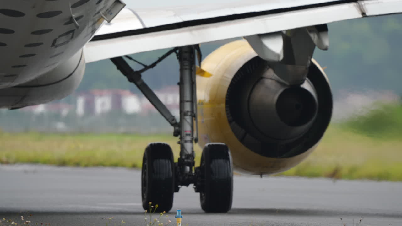Close-up view of an aircraft engine, highlighting mechanical components and engineering design