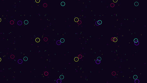círculos coloridos bailando en un lienzo negro