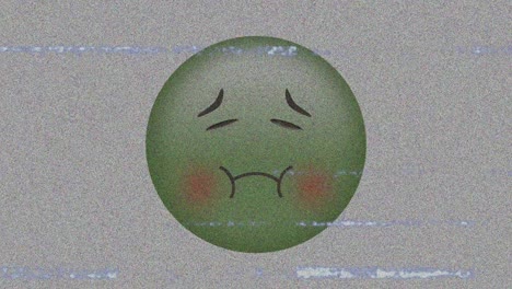 Digital-animation-of-tv-static-effect-over-sick-face-emoji-against-grey-background