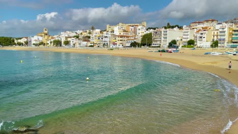 Platja-de-les-Barques-sea-field-Maresme-Barcelona-Mediterranean-coast-plane-close-to-turquoise-blue-transparent-water-beach-without-people