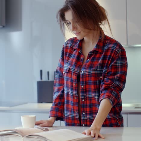 beautiful girl spending morning in her kitchen