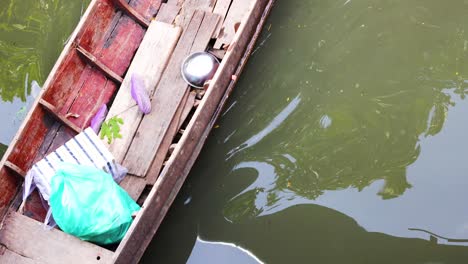 person rowing boat at bangkok market