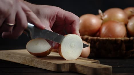 hands men cut the onions in rings.