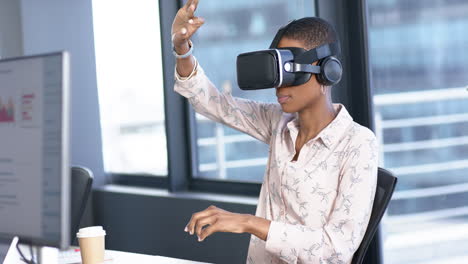 African-american-businesswoman-using-vr-headset-in-office,-slow-motion,-copy-space