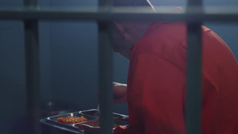 neighbour prisoner holds head and looks in window          (stock footage)