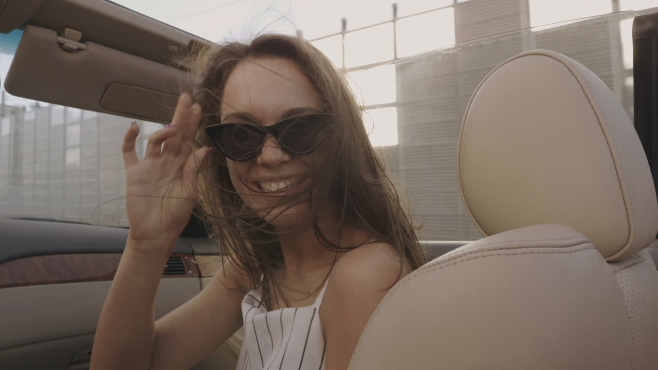 Woman enjoying a convertible drive