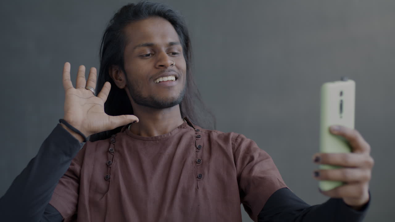 Man taking a selfie and video calling