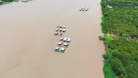 aerial view - circle close - of houses on the river in ben tre.