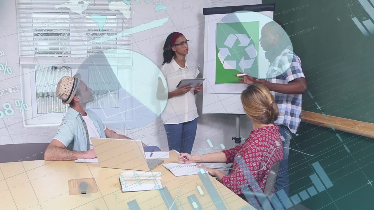 Animation of diverse data and graphs over happy diverse female and male workers in office