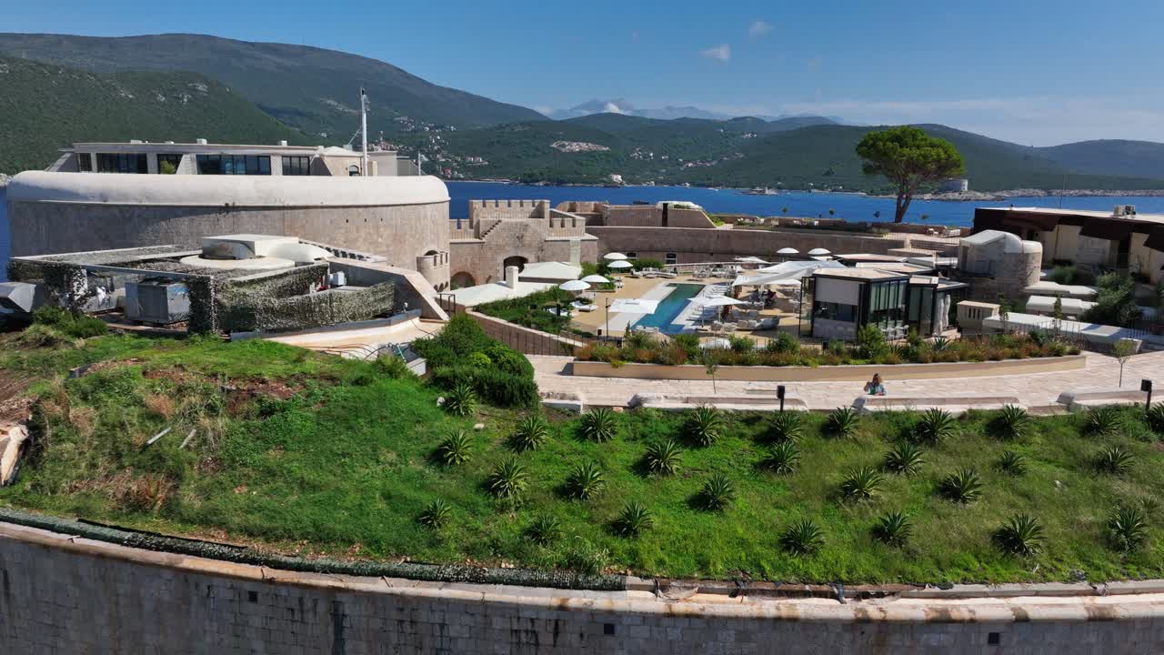 Mamula Fortress and luxury hotel on Mamula Island, Montenegro. Ascending backward drone aerial