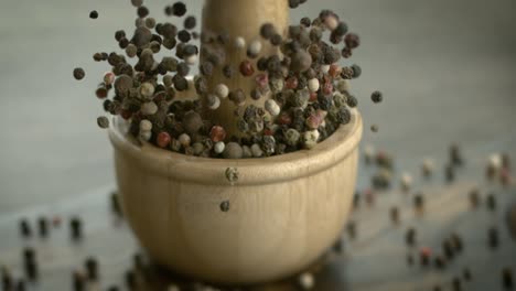 Mixed-peppercorns-in-a-super-slow-motion.-Dry-mix-peppercorns-close-up.