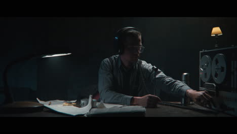 an intelligence officer is working at the wiretap station