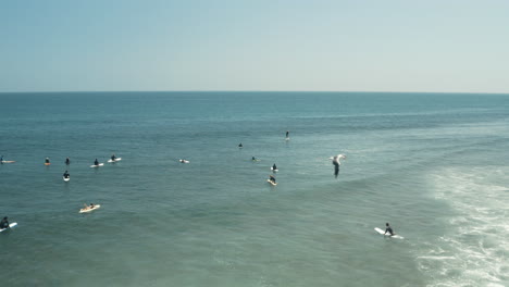 flyover surfers waiting in line at surfrider beach in malibu california