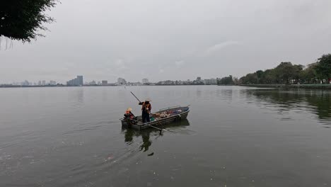 volunteers collecting trash from a river