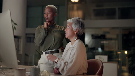 businesswomen collaborating in modern office
