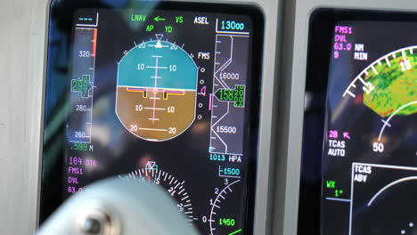 close up airliner aircraft cockpit pfd instruments in flight