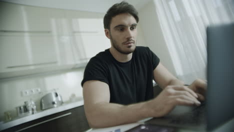 Happy-man-talking-mobile-phone-at-home.-Portrait-of-smiling-business-man