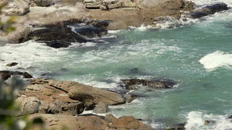 Waves-crashing-onto-rocks,-Noordhoek-Beach-South-Africa