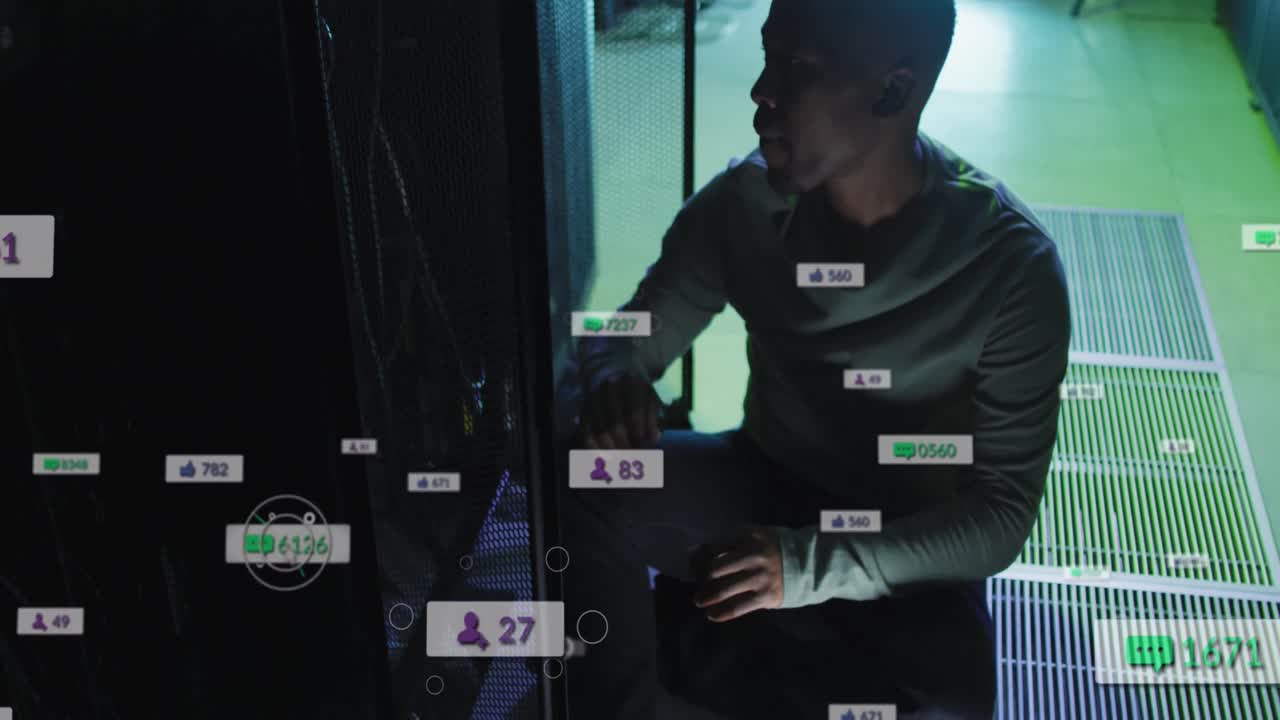 Animation of media icons over businessman using computer
