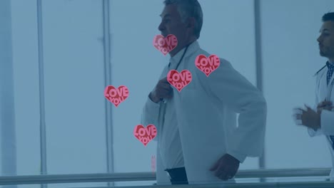 Animation-of-hearts-with-love-over-diverse-doctors-running-on-corridor