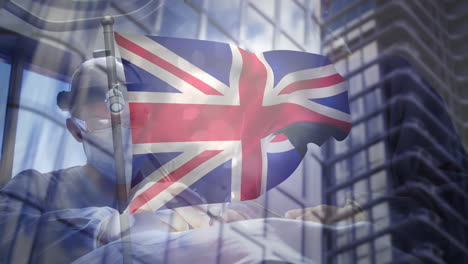 animación de la bandera del reino unido sobre los médicos durante la cirugía