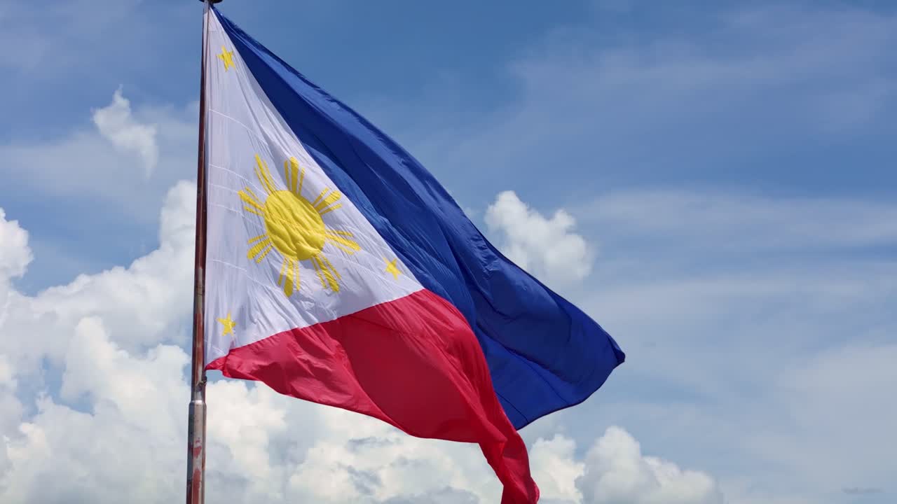 Daytime Philippine Flag Flying Proudly Against Clear Blue Sky