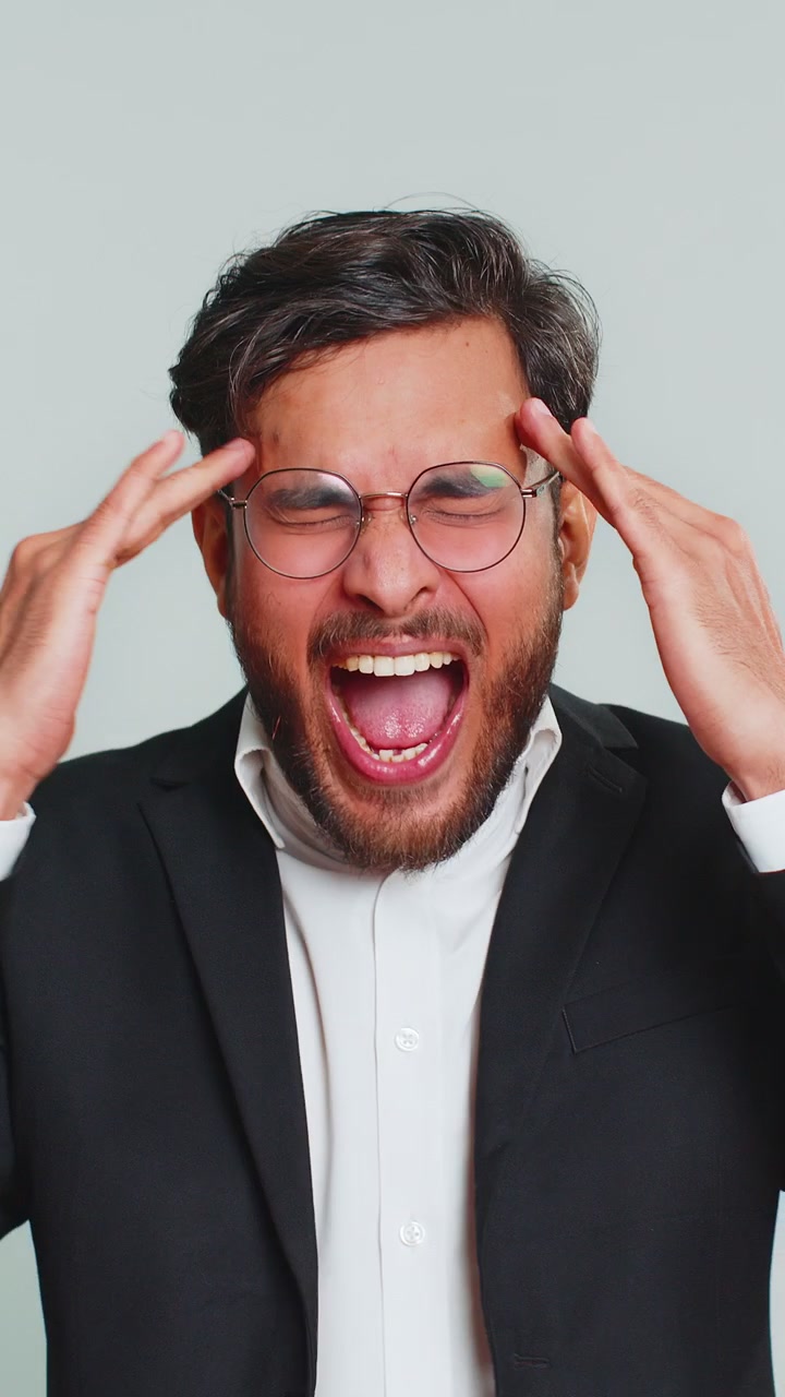 Irritated angry business man screams from stress tension problems shock rage nervous quarrel
