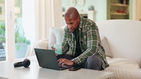 man working on laptop at home