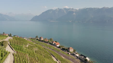 Aerial-of-road-running-past-lake-Geneva,-Switzerland