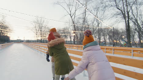 family ice skating fun in the park