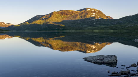 vibrant sunrise timelapse by the lake vavatn in hemsedal, norway