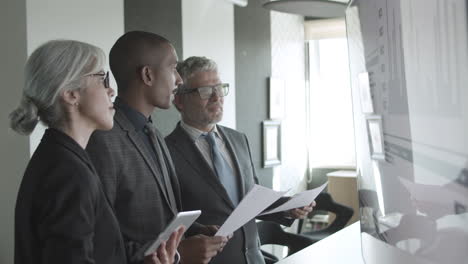 african american financial broker giving consultation to his colleagues