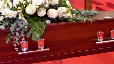 closeup-shot-of-a-funeral-casket-or-coffin-in-a-hearse-or-chapel-or-burial-at-cemetery