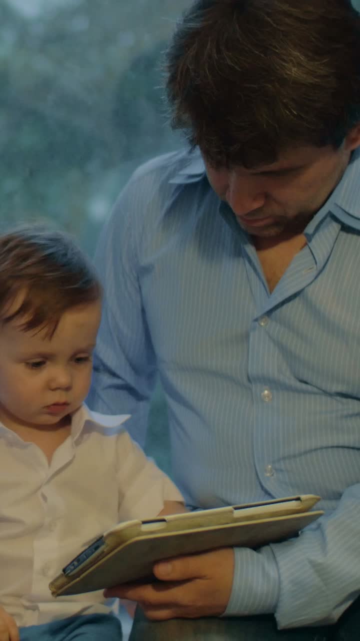 Father and Child Bonding with a Tablet