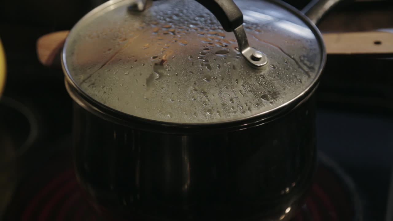 A Simmering Hot Pot In The Kitchen - Close Up Shot