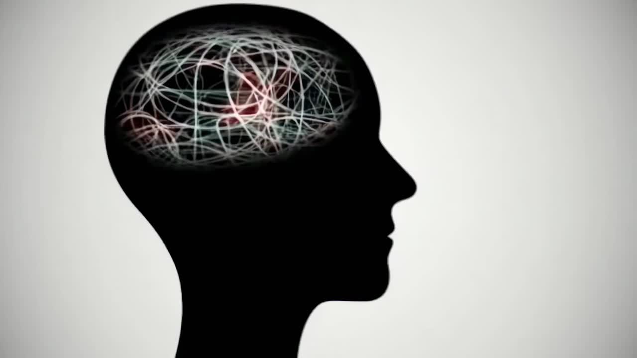 Silhouette of a head with tangled lines inside, side view