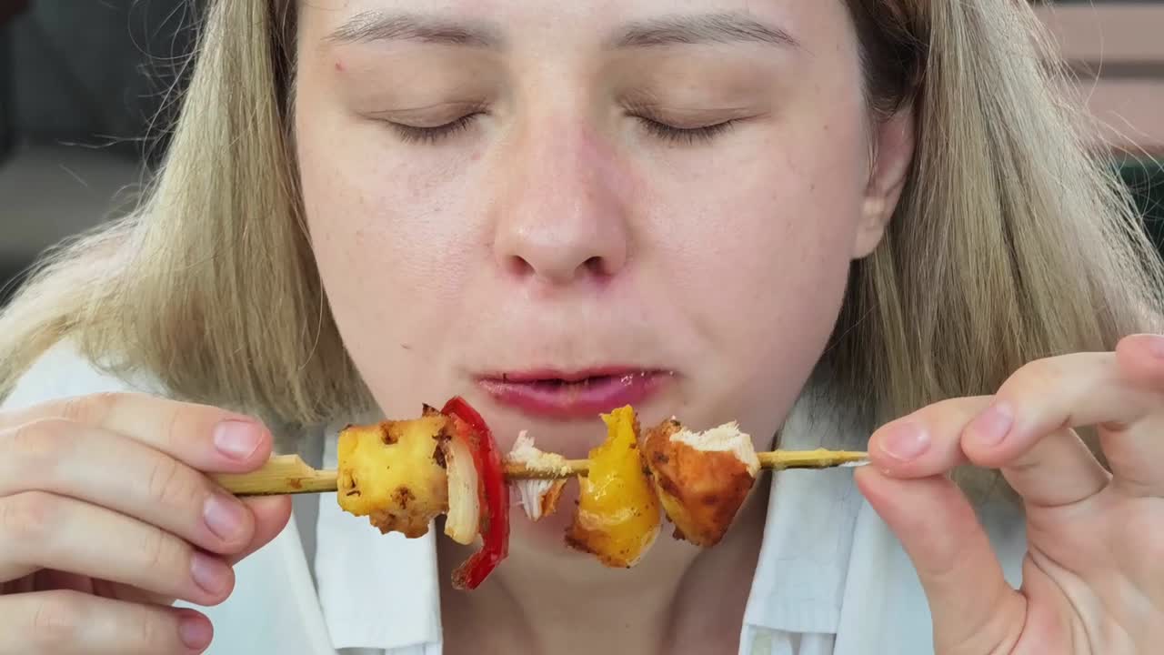 Woman Eating Skewers