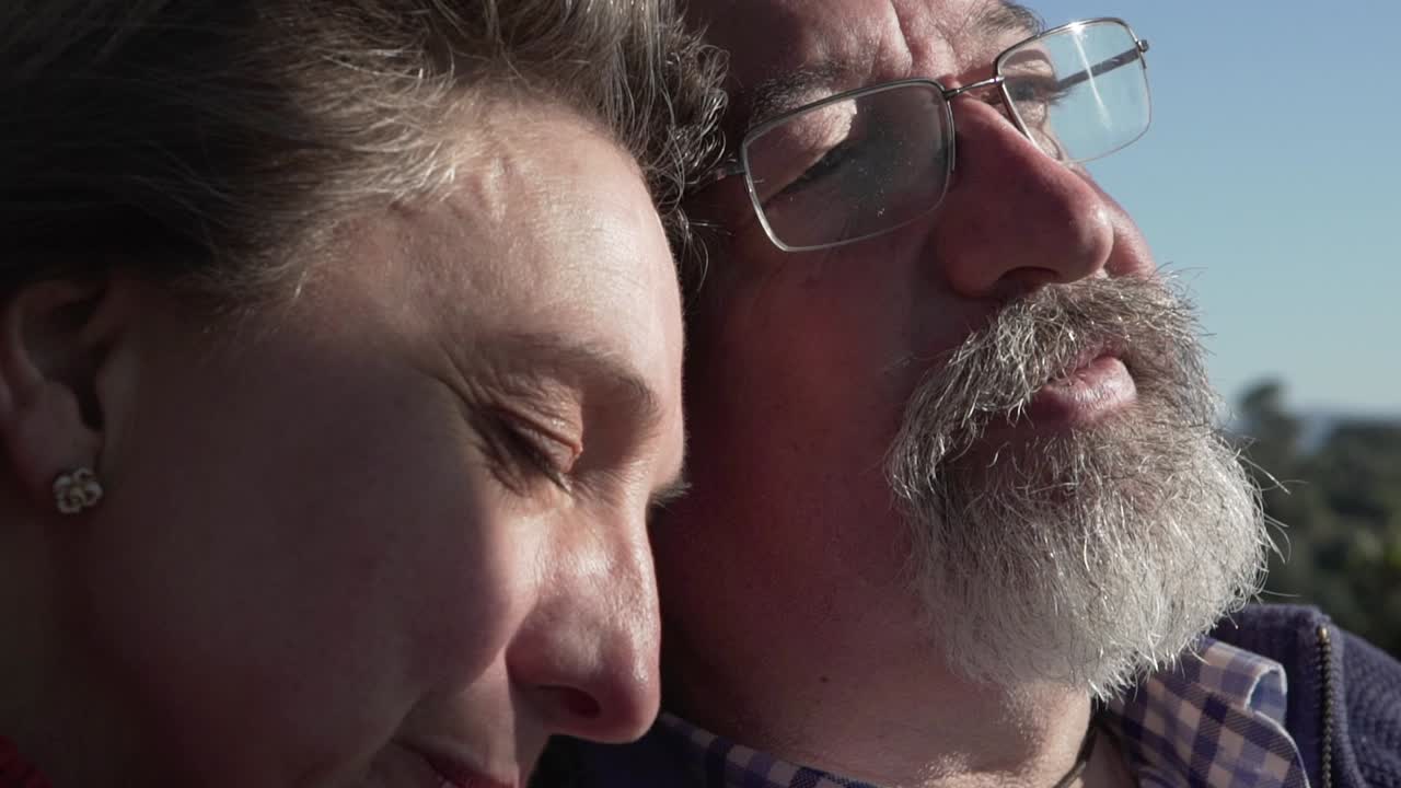 Elderly couple relaxing together in nature