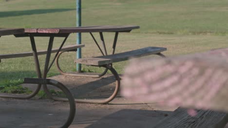 rundown picnic table area in empty playground