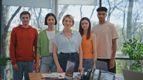 diverse business people posing office interior. startup team corporate portrait